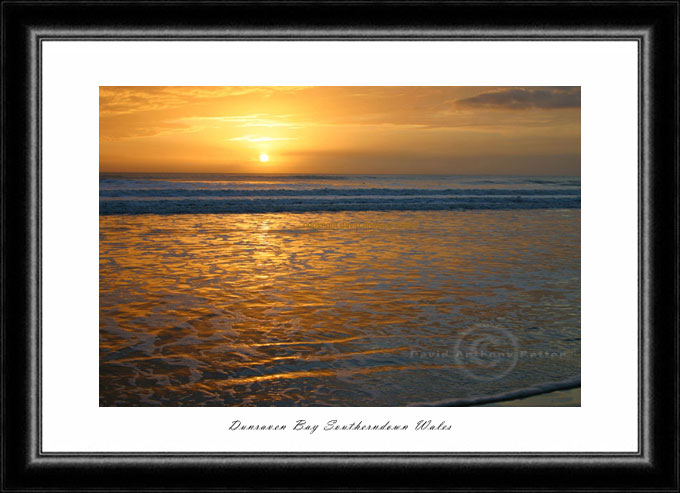 photo of sunset reflecting in the water at southerndown bay wales
